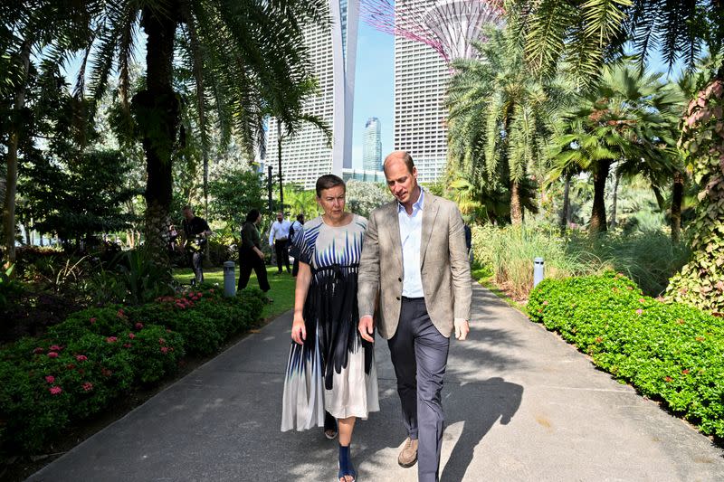 Britain's Prince William walks with Hannah Jones, CEO of The Earthshot Prize, at the base of the Supertrees in Gardens by the Bay in Singapore