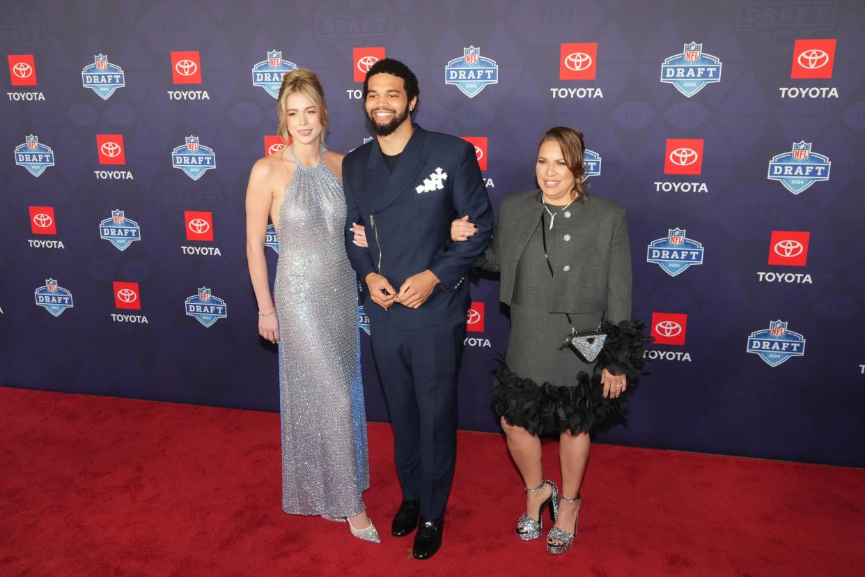 Southern California Trojans quarterback Caleb Williams stands on the red carpet ahead of the 2024 NFL Draft at Detroit’s Fox Theatre.