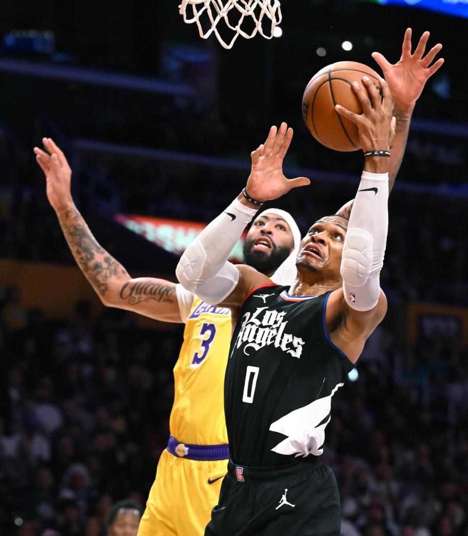 The Clippers' Russell Westbrook drives on the Lakers' Anthony Davis during the first quarter Wednesday night.