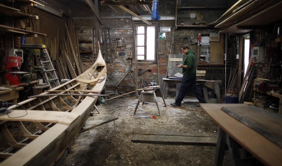 Lorenzo Della Toffola works on a piece for a gondola at the San Trovaso boatyard known as a