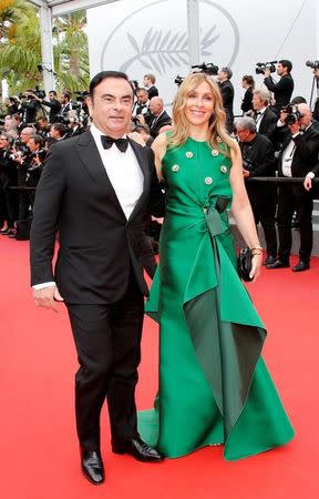 70th Cannes Film Festival – Screening of the film "L'Amant double" (Amant Double) in competition - Red Carpet Arrivals - Cannes, France. 26/05/2017. Carlos Ghosn, Chairman and CEO of the Renault-Nissan Alliance, and his wife Rita pose. REUTERS/Jean-Paul Pelissier