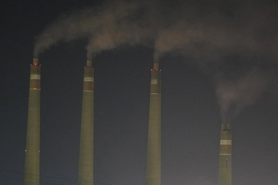 Steams spews from the chimneys of a coal power plant, in Cilegon, Banten province, Indonesia, on Oct. 3, 2023. Pollution is causing respiratory illnesses and deaths to rise in Indonesia's island of Java, including the capital, Jakarta. Data gathered by IQAir, a Swiss air technology company, regularly ranks Jakarta as one of the most polluted cities in the world. Blue skies are a rare sight and the air often smells like fuel or heavy smoke. (AP Photo/Achmad Ibrahim)