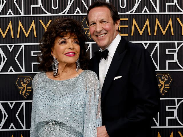 <p>Frazer Harrison/Getty </p> Dame Joan Collins and Percy Gibson attend the 75th Primetime Emmy Awards on January 15, 2024 in Los Angeles, California.