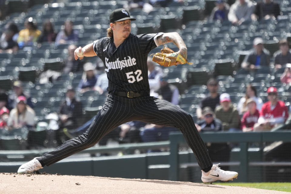 Chicago White Sox starting pitcher Mike Clevinger winds up during the first inning of a baseball game against the Philadelphia Phillies Wednesday, April 19, 2023, in Chicago. (AP Photo/Charles Rex Arbogast)