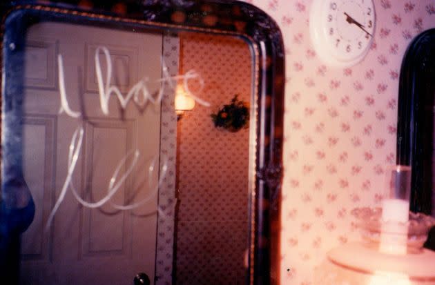 This message on the bathroom mirror, captured in a photo from Nov. 17, 1989, reads, 