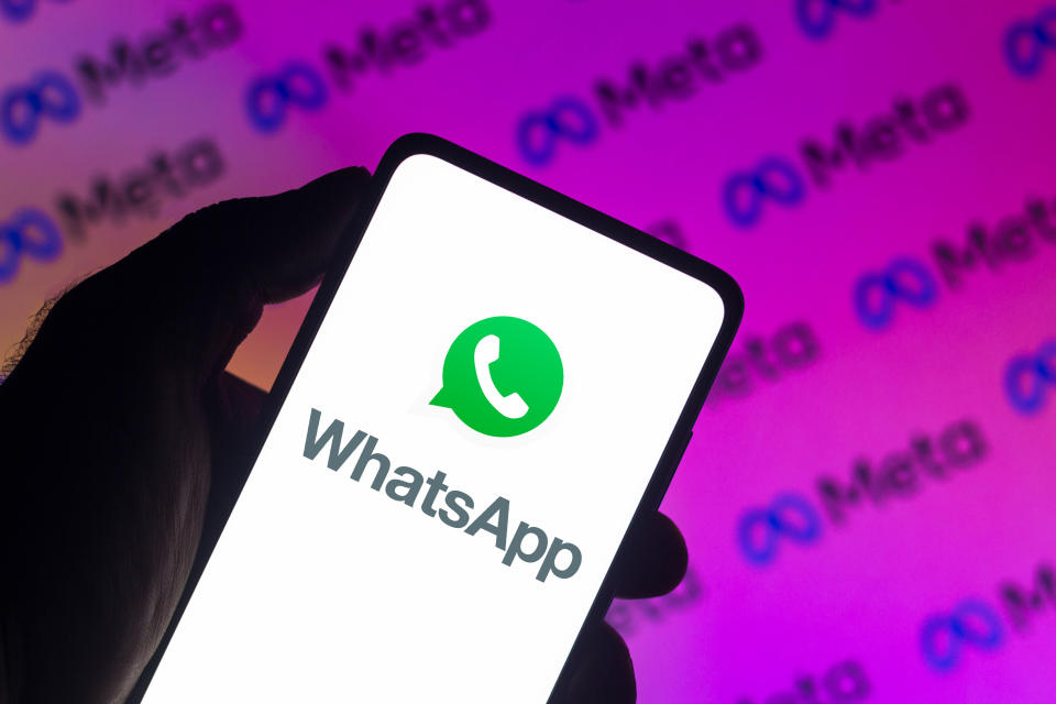 BRAZIL - 2021/12/13: In this photo illustration a WhatsApp logo seen displayed on a smartphone with a Meta Platforms logo in the background. (Photo Illustration by Rafael Henrique/SOPA Images/LightRocket via Getty Images)