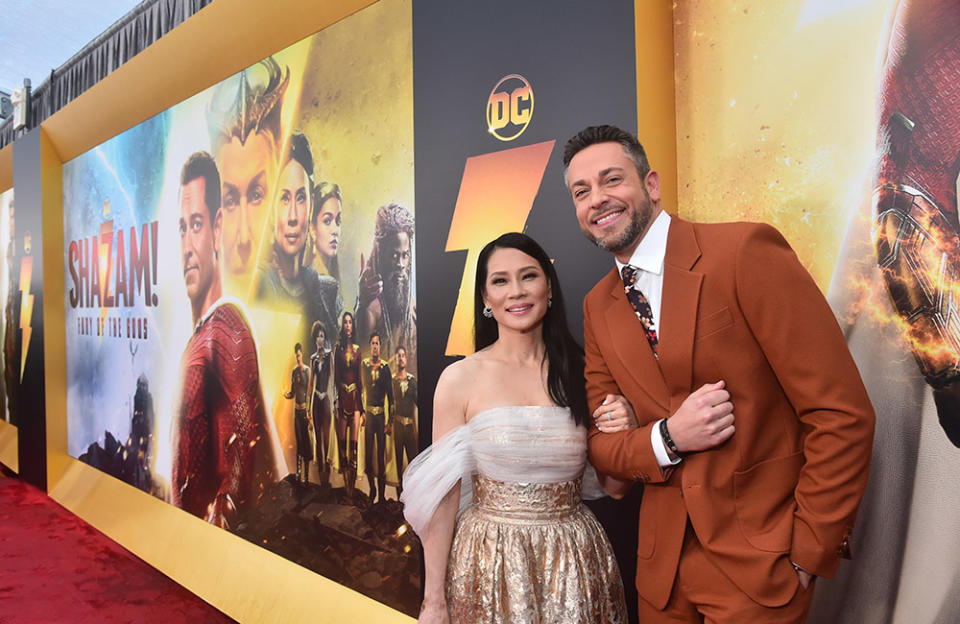 Lucy Liu and Zachary Levi attend the premiere of Warner Bros.' "Shazam! Fury Of The Gods" at Regency Village Theatre on March 14, 2023 in Los Angeles, California.