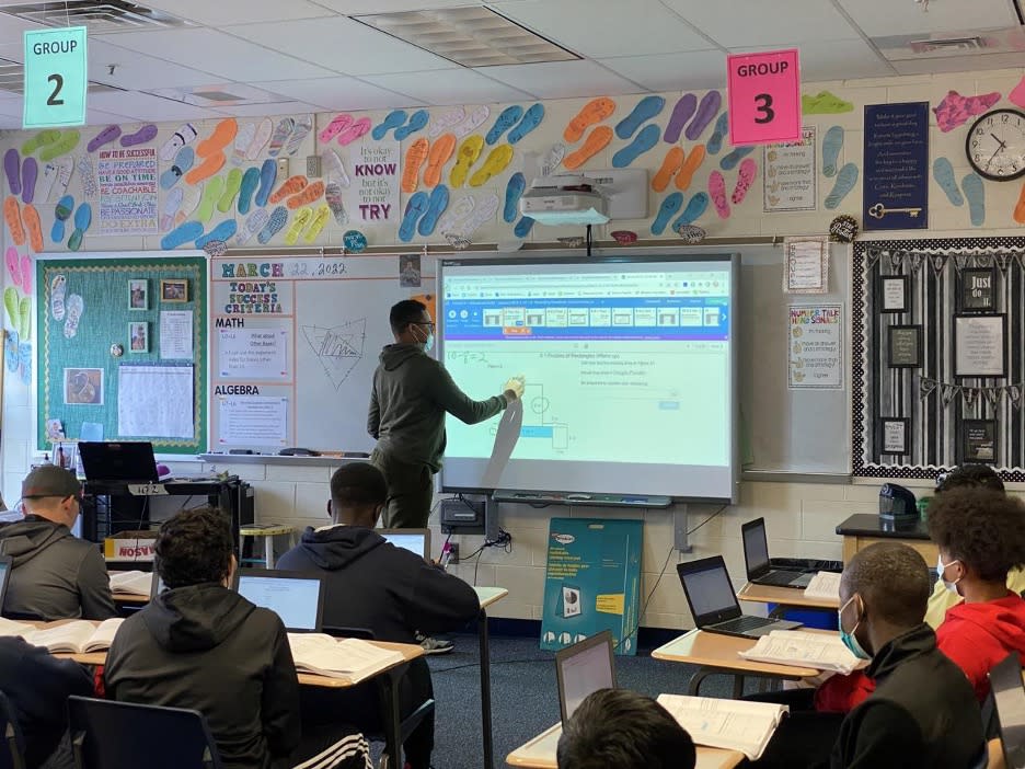 In Debra Pratt’s eighth grade math class at Postlethwait Middle School in Wyoming, Delaware, students demonstrate at the board different strategies for factoring quadratics. (Knowledge Matters Campaign)