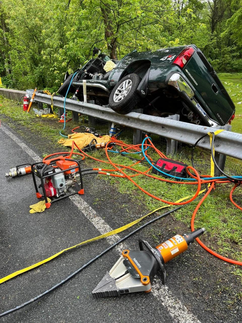 Hydraulic rescue tools are seen on the ground after firefighters cut one victim out of this pick-up truck after a vehicle crash with entrapment on the 200 block of Boyds School Road, Wednesday, May 15, 2024, in Cumberland Township