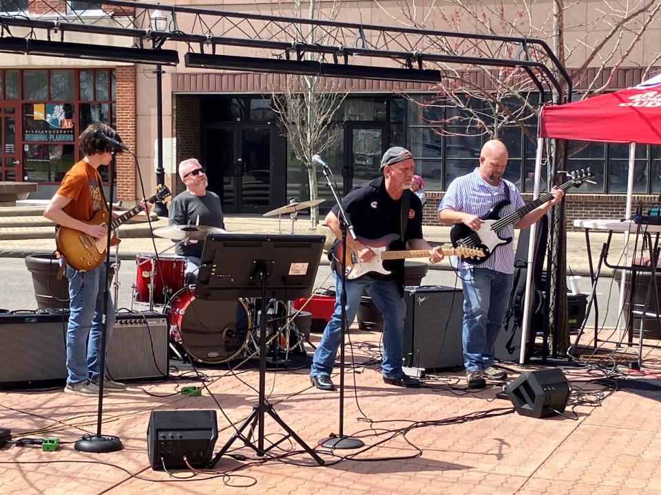 The Jimi Vincent Band provided entertainment outside Dan Lew Exchange ahead of Monday's total solar eclipse.