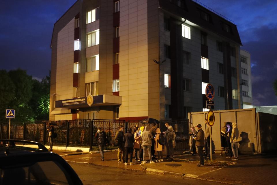 People wait to meet their detained friends and relatives in front of a detention center in Minsk, Belarus, Thursday, Aug. 27, 2020. Police in Belarus have dispersed protesters who gathered on the capital's central square, detaining dozens. (AP Photo/Dmitri Lovetsky)