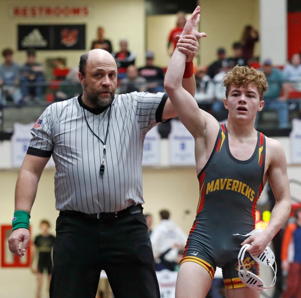 McCutcheon Aiden Dallinger has his hand raised during the IHSAA wrestling sectionals meet, Saturday, Jan. 27, 2024, at Lafayette Jeff High School in Lafayette, Ind.