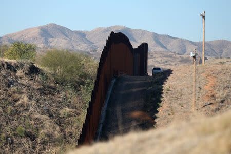 A U.S. border patrol agent patrols the U.S. border with Mexico in Nogales, Arizona, U.S., January 31, 2017. REUTERS/Lucy Nicholson