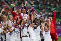 Soccer Football - Women's Champions League Final - Ferencvaros Stadium, Budapest, Hungary - May 18, 2019 Olympique Lyonnais' Dzsenifer Marozsan and team mates celebrate winning the Women's Champions League with the trophy REUTERS/Lisi Niesner