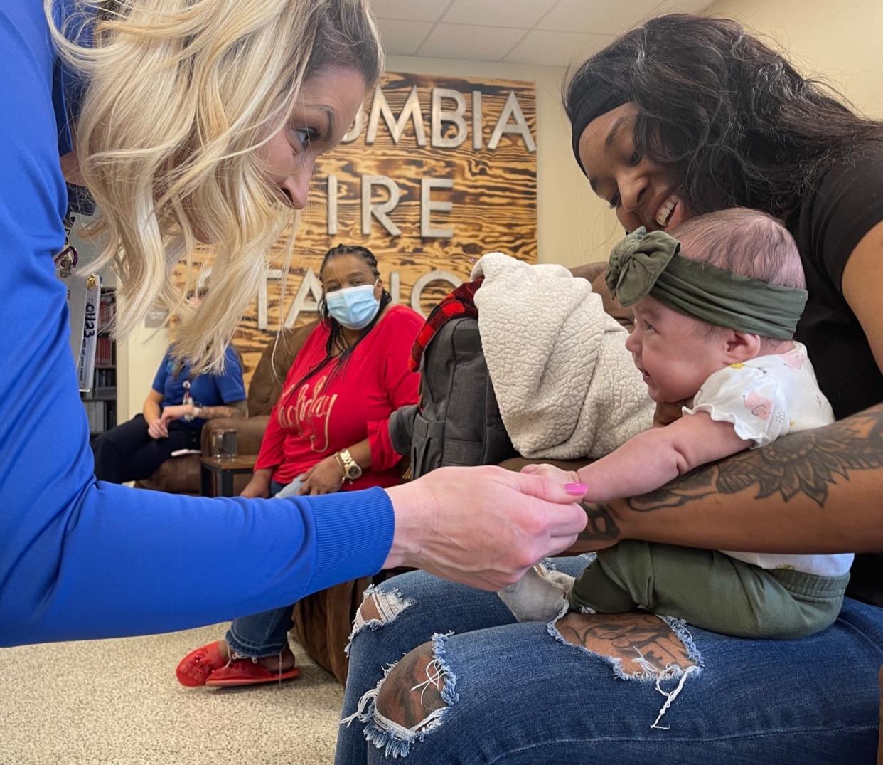 Newborn Za’Myla Camilla Miracle Garrett and her mother Kitana Garrett visit Columbia Fire & Rescue Station 3 in Columbia, Tenn., on Tuesday, March 1, 2022.