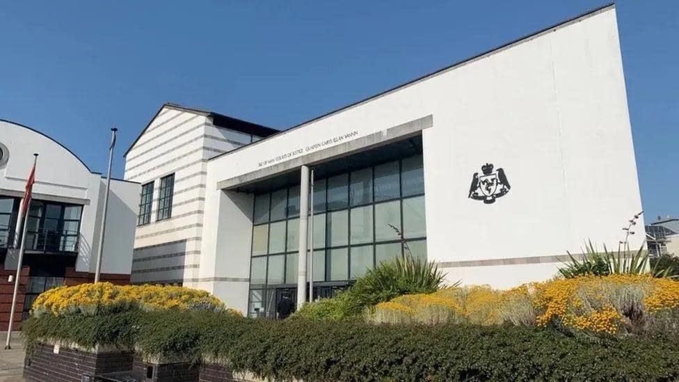 The white Isle of Man Courts of Justice building on a sunny day