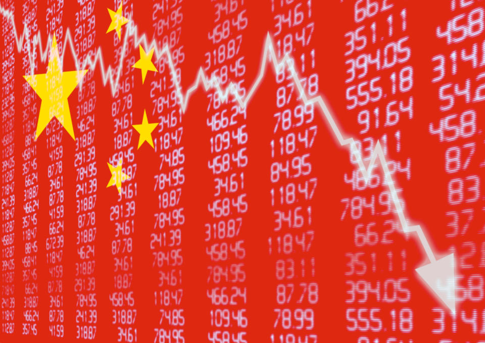 Downward pointing stock chart superimposed on Chinese flag and columns of numbers