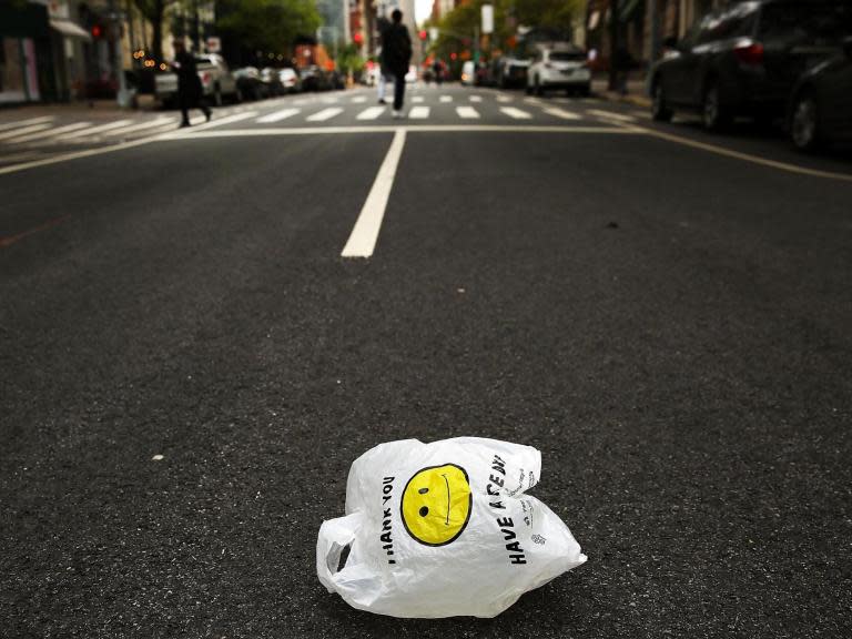 Attention, New York City shoppers: don’t think you’re going to easily avoid the statewide ban on plastic bags just by switching to paper ones.Starting next year, those are also going to cost you 5 cents each.When New York state lawmakers approved the ban on single-use plastic carryout bags – essentially ending the “paper or plastic?” quandary – they gave local governments the option to charge extra for paper alternatives.The New York City Council has done just that, voting to tack on a nickel fee for each paper carryout bag a customer uses at retail and grocery stores.The bill, approved Thursday in a 38-to-9 vote, came less than a month after New York became the second state, after California, to ban most plastic bags. Govenor Andrew Cuomo signed the plastic-bag ban into law during Monday’s celebration of Earth Day.Environmental advocates applauded New York’s plan for curbing single-use plastic bags, but have said it could encourage shoppers to swap plastic for paper – essentially trading one form of waste for another.The city’s legislation authorizing the 5-cent fee offers similar exceptions as the new state law, including an exemption for restaurant takeout bags. But lawmakers say the paper-bag fee is an important step in reducing overall waste.And if the fee has its intended effect – encouraging people to change their shopping behaviour – most customers would not feel squeezed by the charge, Councilman Brad Lander said. “The goal is not to collect a single nickel,” said Lander, a Democrat from Brooklyn. “The goal is to help people bring reusable bags.”The city’s Sanitation Department collects nearly 30,000 tons of paper bags every year, according to Belinda Mager, a spokeswoman.The 5-cent fee will “ensure that clogged storm drains, polluted waterways and parkland riddled with non-biodegradable bag waste will be a part of New York City’s past,” Councilwoman Margaret S. Chin, a Democrat who represents Lower Manhattan and was one of the bill’s primary sponsors, said in a statement.Mayor Bill de Blasio, who has expressed support for the 5-cent fee, still must sign the bill into law. It would take effect in March when the plastic-bag ban begins.New York City will not be the only municipality with a paper-bag fee. Before the governor’s bill, the city of Long Beach and Suffolk County, both in Long Island, each implemented a fee on paper and plastic bags. Officials in Suffolk County said last month that their law, which went into effect in 2018, led to a massive reduction in plastic-bag use.Ulster County also voted to adopt a paper bag fee, which is scheduled to take effect in July.The legislation that passed Thursday was the latest step in a years-long effort to curb the use of carryout bags. The bag fee was first introduced in 2008 by former Mayor Michael Bloomberg, who eventually dropped the idea amid opposition.Chin and Lander took up the cause years later, and in May 2016, the City Council narrowly voted to approve a 5-cent fee on both paper and plastic bags.But a coalition of state lawmakers intervened, arguing the fee was a form of government overreach that would impose an undue financial burden on poor New Yorkers.Mr Cuomo ultimately signed a bill to block the city’s fee in February 2017. At the time, he said the city’s law was “deeply flawed” because it would have allowed merchants to keep the fee as a profit.The statewide bag bill championed by Mr Cuomo, a third-term Democrat, requires local governments that charge a paper-bag fee to use some of the revenue to provide free reusable bags to residents, especially those in lower-income communities. The rest of the money would go to the state’s Environmental Protection Fund.Under New York City’s plan, 2 cents from every paper-bag fee would go towards boosting an existing initiative that has already provided close to 475,000 free reusable bags to city residents.Mike Durant, president of the Food Industry Alliance of New York State, which represents grocery stores, said he was concerned that no money from the city’s paper bag fee would go to retailers, who could bear additional costs because of the policy.Mr Durant said that city lawmakers failed to consider how a seemingly small fee can cut into profit margins.“New York City’s cost of doing business is really high and can be onerous,” Mr Durant said.Councilman Robert Holden, a Democrat from Queens who voted against the bill, said he worried the fee would put an undue burden on consumers as well.“As if it wasn’t enough that we are taxed to death in every facet of our lives, the New York City Council has just passed another regressive tax,” he said in a statement.The New York Times