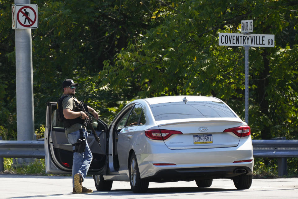 A law enforcement officer stands guard as the search for escaped convict Danelo Cavalcante continues in Pottstown, Pa., Tuesday, Sept. 12, 2023. (AP Photo/Matt Rourke)