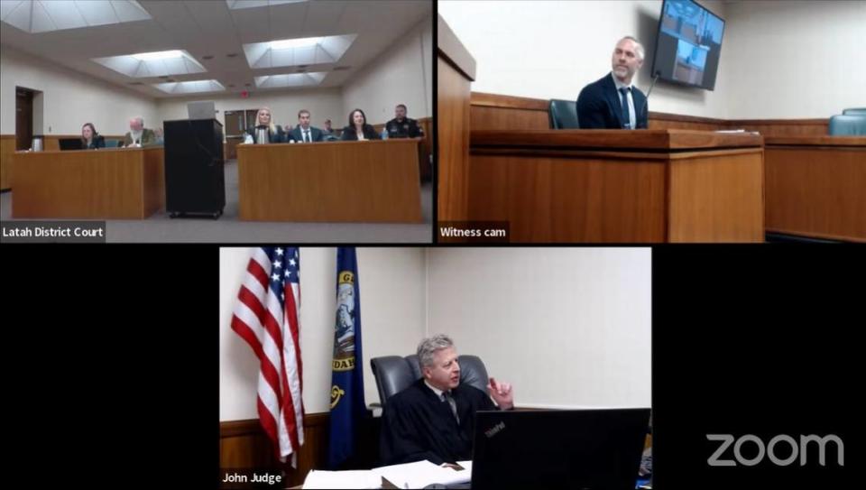 Judge John Judge, bottom, of Idaho’s 2nd Judicial District in Latah County, clarified information with Bryan Edelman, upper right, a trial jury consultant hired by the defense for University of Idaho student homicide suspect Bryan Kohberger, at a pretrial hearing on Wednesday at the Latah County Courthouse in Moscow. Latah County Court/Provided