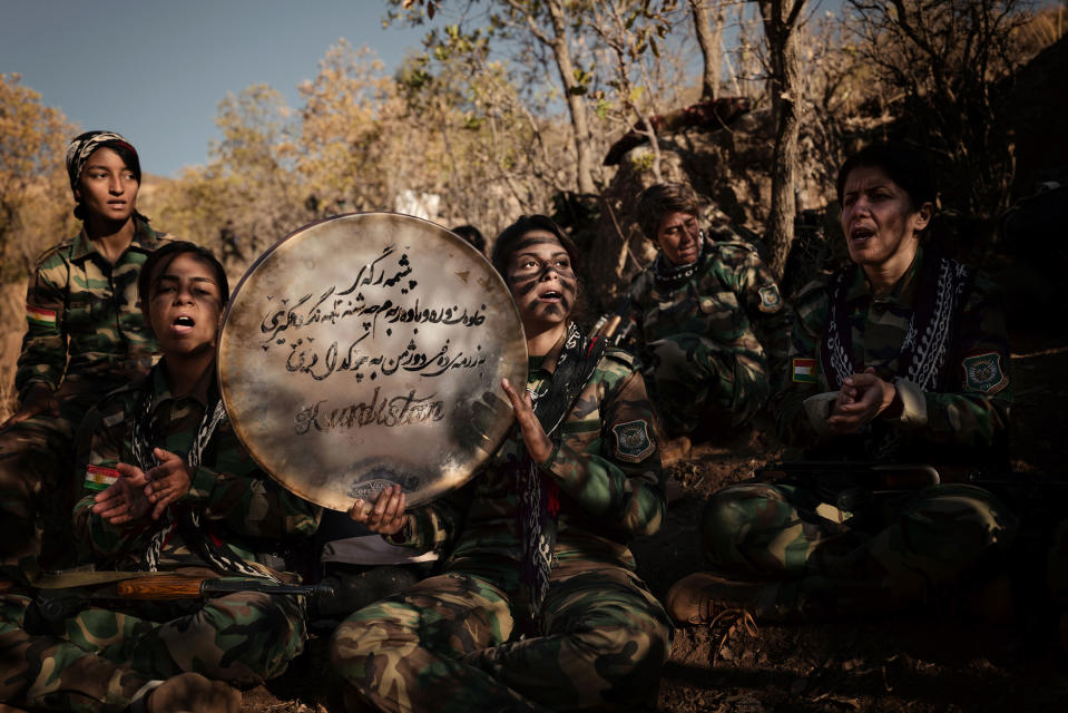 Female members of the Iranian opposition group Kurdistan Freedom Party (P.A.K.) sing protest songs in the Kurdistan Region of Iraq, on Nov. 15, 2022.<span class="copyright">Emily Garthwaite—The New York Times/Redux</span>