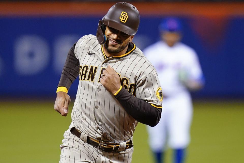 San Diego's Trent Grisham rounds the bases after hitting a solo home run.