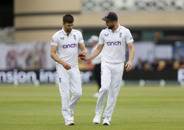 England’s Mark Wood (left) and Chris Woakes during day three