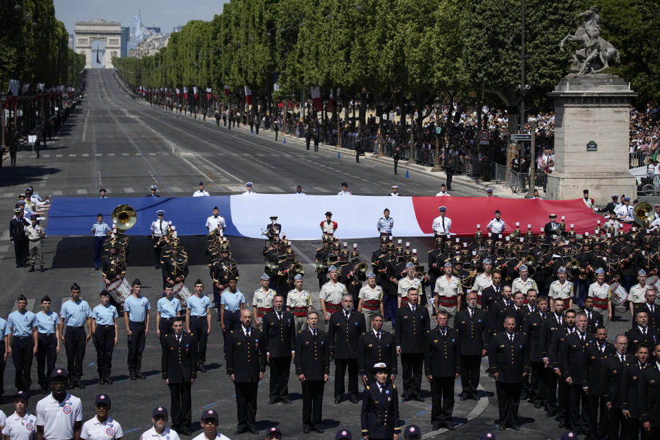 A general view of the Champs-Elysees avenue during the Bastille Day parade in Paris, Friday, July 14, 2023. (AP Photo/Christophe Ena)