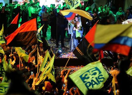 Ecuadorean presidential candidate Lenin Moreno (C) and supporters celebrate in a hotel in Quito, Ecuador, April 2, 2017. REUTERS/Mariana Bazo