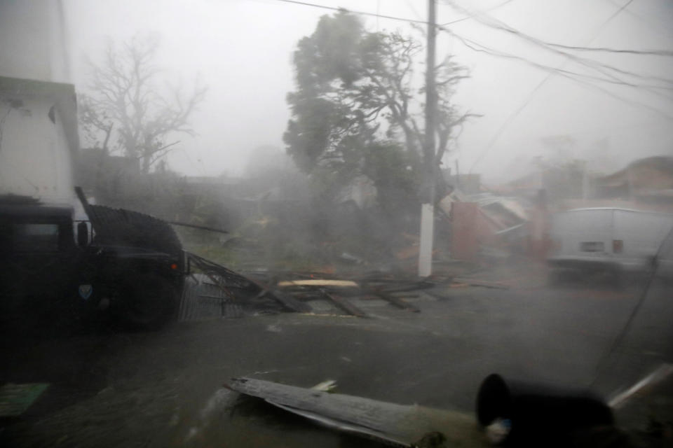 <p>Damage and flooded streets are seen after the area was hit by Hurricane Maria in Guayama, Puerto Rico on Sept. 20, 2017. (Photo: Carlos Garcia Rawlins/Reuters) </p>