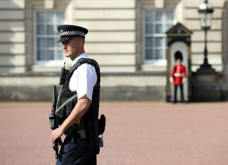 A police officer patrols within the grounds of Buckingham Palace in London, Britain August 26, 2017. REUTERS/Paul Hackett