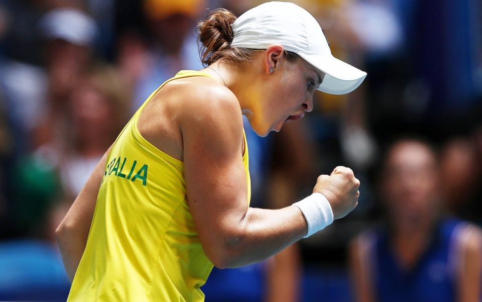 Ash Barty celebrates after demolishing Caroline Garcia 6-0, 6-0 - REX