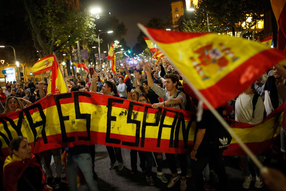 <p>Anti-independence supporters shout slogans and wave Spanish flags as they march against the unilateral declaration of independence approved earlier by the Catalan parliament in downtown Barcelona Friday, Oct. 27, 2017. (Photo: Francisco Seco/AP) </p>