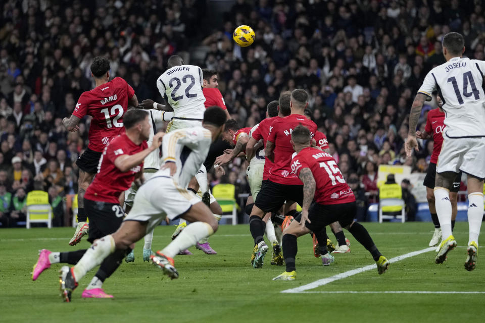 Real Madrid's Antonio Rudiger scores his side's first goal during the Spanish La Liga soccer match between Real Madrid and Mallorca at the Santiago Bernabeu stadium in Madrid, Spain, on Wednesday, January 3, 2024. (AP Photo/Bernat Armangue)