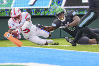 SMU wide receiver Danny Gray, left, scores a touchdown in the first half against Tulane defensive end Cameron Sample, right, during an NCAA college football game in New Orleans, Friday, Oct. 16, 2020. (AP Photo/Matthew Hinton)