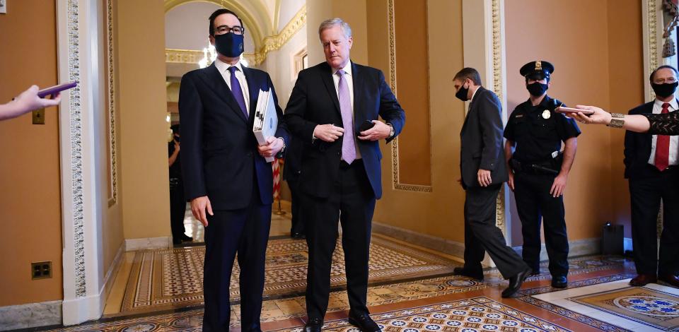 Treasury Secretary Steven Mnuchin (left) and White House Chief of Staff Mark Meadows speak to reporters on Monday about the ongoing negotiations to reach an agreement with lawmakers on a new coronavirus relief bill. (Photo: MANDEL NGAN via Getty Images)