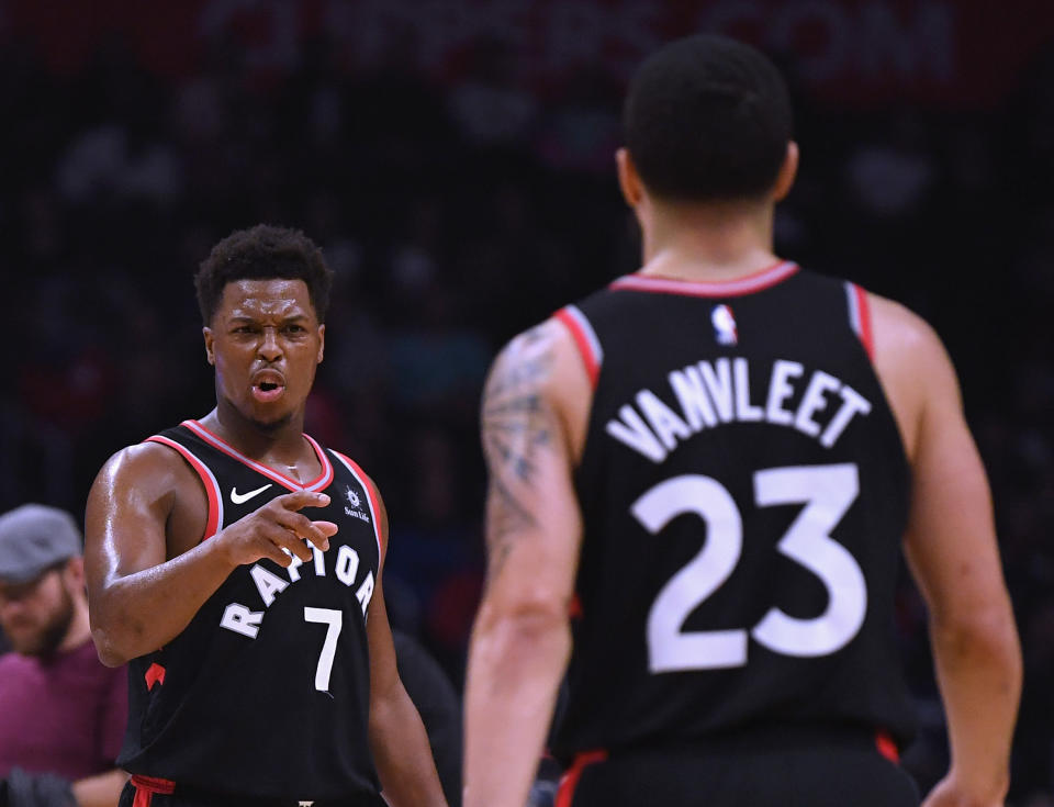 LOS ANGELES, CA - DECEMBER 11:  Kyle Lowry #7 of the Toronto Raptors celebrates a 103-74 lead with Fred VanVleet #23 at the end of the third quarter at Staples Center on December 11, 2018 in Los Angeles, California.  NOTE TO USER: User expressly acknowledges and agrees that, by downloading and or using this photograph, User is consenting to the terms and conditions of the Getty Images License Agreement.  (Photo by Harry How/Getty Images)