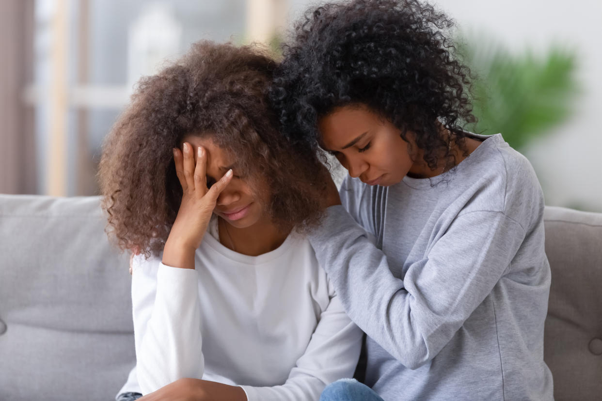 A mum comforting her daughter as GSCE results are released today. (Getty Images)