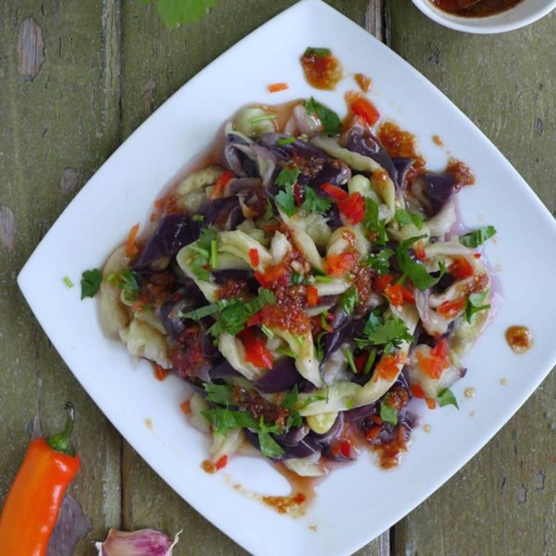 <p>Red House Spice</p><p>Steamed to a creamy, melt-in-your-mouth texture, then seasoned with a pungent chilli-garlic dressing, this Chinese aubergine salad is simple yet delectable.</p><p><strong>Get the recipe: <a href="https://redhousespice.com/aubergine-salad/" rel="nofollow noopener" target="_blank" data-ylk="slk:Aubergine Salad with Garlic Dressing;elm:context_link;itc:0;sec:content-canvas" class="link ">Aubergine Salad with Garlic Dressing</a></strong></p>