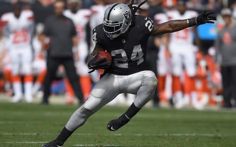 Marshawn Lynch #24 of the Oakland Raiders runs with the ball against the Cleveland Browns during the second quarter of their NFL football game at Oakland - Credit: (Thearon W. Henderson/Getty Images)