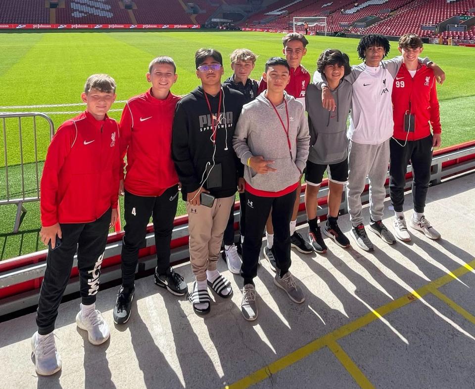 Armando Guandique, third from left, visits Anfield Stadium, the home of Liverpool FC, with his U.S. teammates.
