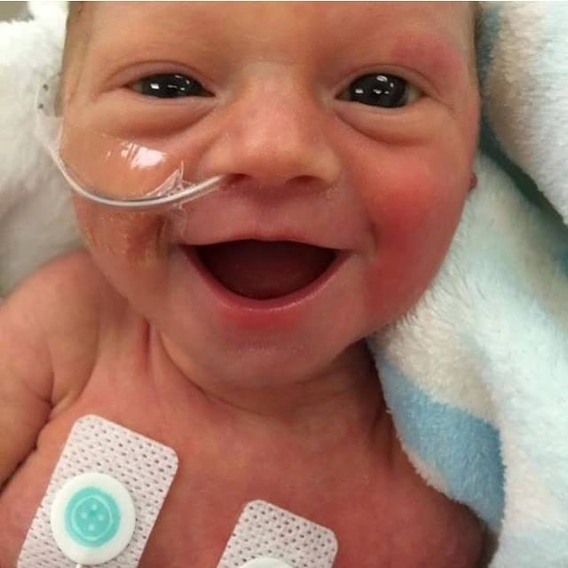 This 5-day-old girl had much to smile about. (Photo: Lauren Vinje/Facebook)