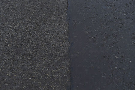 The change in road surface which denotes the exact border with County Armagh in Northern Ireland on the left and County Monaghan in the Republic of Ireland on the right on the border village of Middletown, Northern Ireland, December 9, 2017. REUTERS/Clodagh Kilcoyne