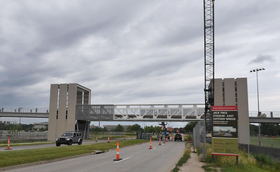 The Jack Trice Stadium East Gateway Bridge over University Boulevard is shown when it was under construction July 8. The new bridge connects the stadium to expanded parking areas east of the sports complex.