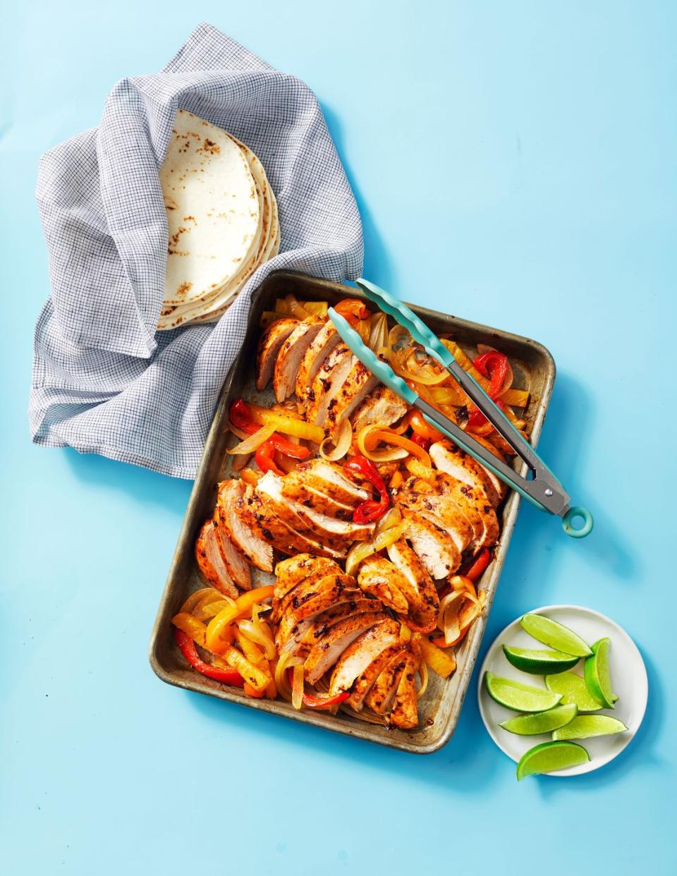 <p>Fajitas have never been easier than in this one-pan recipe, loaded with juicy chicken, peppers and onions with smoky adobo.</p><p>Get the <strong><a href="https://www.goodhousekeeping.com/food-recipes/a38666678/sheet-pan-chicken-fajitas-recipe/" rel="nofollow noopener" target="_blank" data-ylk="slk:Sheet Pan Chicken Fajitas recipe;elm:context_link;itc:0;sec:content-canvas" class="link ">Sheet Pan Chicken Fajitas recipe</a></strong>.</p><p><strong>RELATED: </strong><a href="https://www.goodhousekeeping.com/food-recipes/easy/g30270283/sheet-pan-dinners/" rel="nofollow noopener" target="_blank" data-ylk="slk:18 Easy Sheet Pan Dinners That Make Cleanup a Breeze;elm:context_link;itc:0;sec:content-canvas" class="link ">18 Easy Sheet Pan Dinners That Make Cleanup a Breeze</a></p>