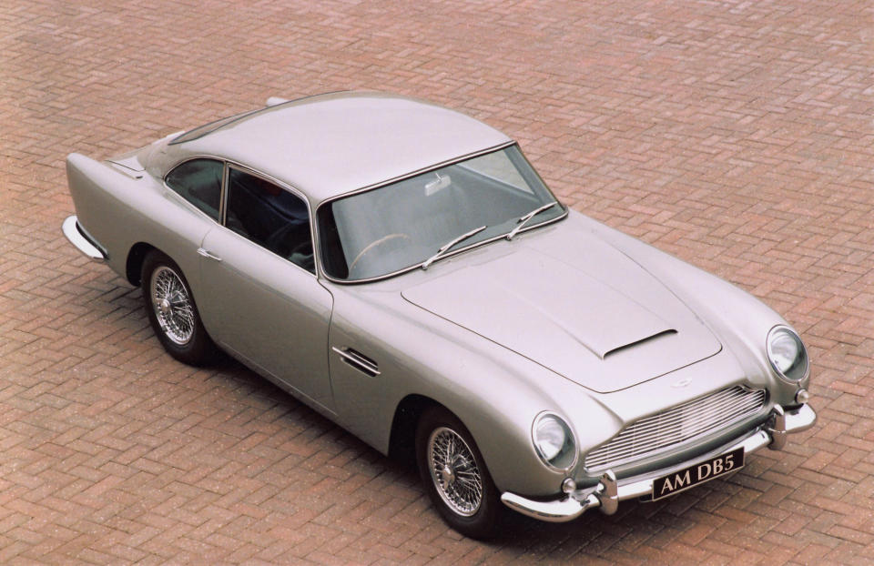 DB5 (1963-1965) – The DB5 was an evolution of the DB4. The main development included a new 4.0 litre engine and the option of a five speed gearbox. The car was originally featured in Goldfinger and most recently Skyfall as James Bond’s preferred car. Only 1059 examples were produced (AMHT)