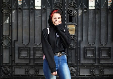 Jade, 16, who voted for the first time in the primary elections, poses in Buenos Aires