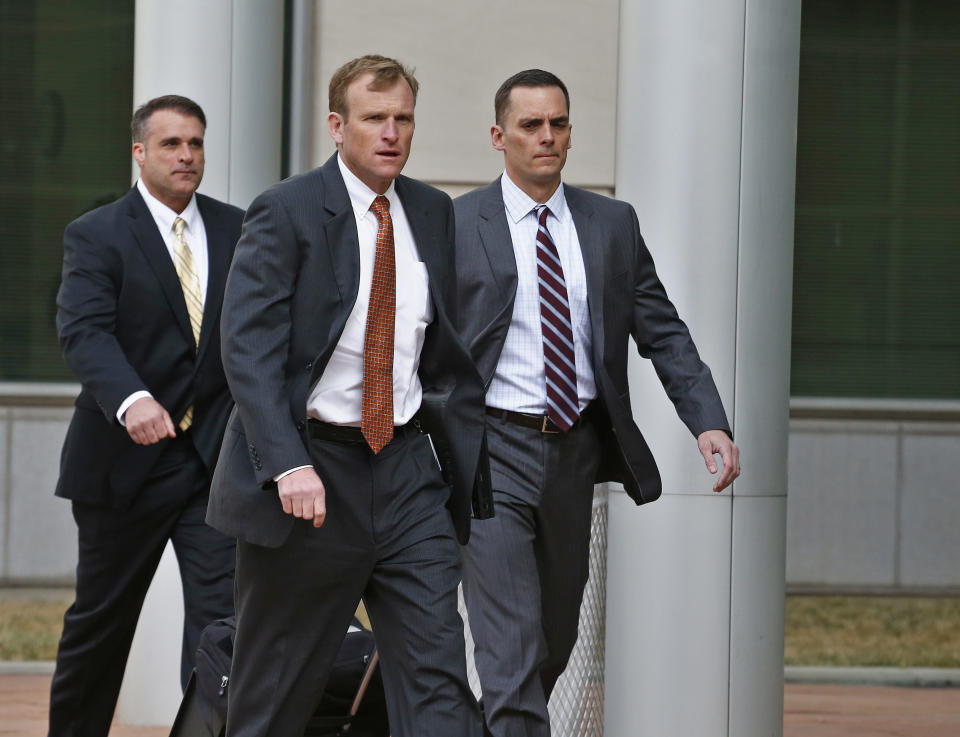 Members of the prosecution team arrive for a sentencing hearing for a woman who pleaded guilty to buying the handgun used to kill Nathan Leon and the director of Colorado Prisons, at the Federal Courthouse, in Denver, Monday March 3, 2014. Stevie Marie Anne Vigil was sentenced to more than two years in prison and three years supervision for buying the handgun for Evan Ebel, a parolee and member of a white supremacist prison gang. (AP Photo/Brennan Linsley)