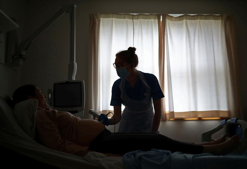 <p>Guidance explicitly states women should not be asked to wear any type of face covering while giving birth </p> (POOL/AFP via Getty Images)