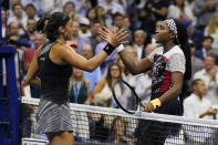 Caroline Garcia, of France, left, shakes hands with Coco Gauff, of the United States, after a quarterfinal of the U.S. Open tennis championships, Tuesday, Sept. 6, 2022, in New York. Garcia won the match. (AP Photo/Charles Krupa)